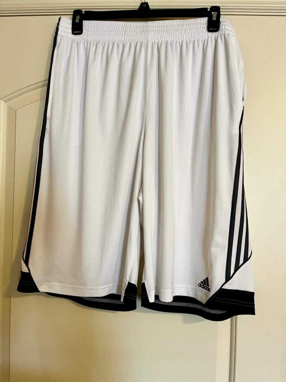 Men’s Adidas White Basketball Athletic Shorts with Black Stripe Trim.